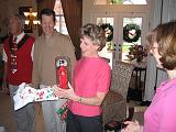 2004-12-25.opening_presents.wendy-sandy-snyder.3.christmas.venice.fl.us.jpg
