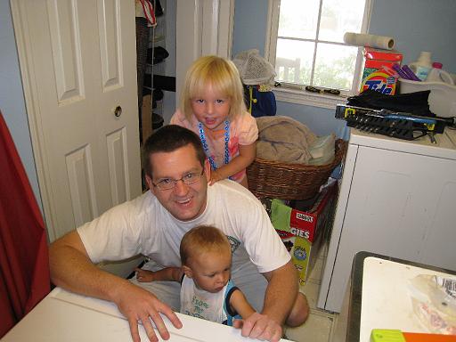 2008-08-18.helping_dad_fix.washer.03.ronan-seren-kevin-snyder.livonia.mi.us 