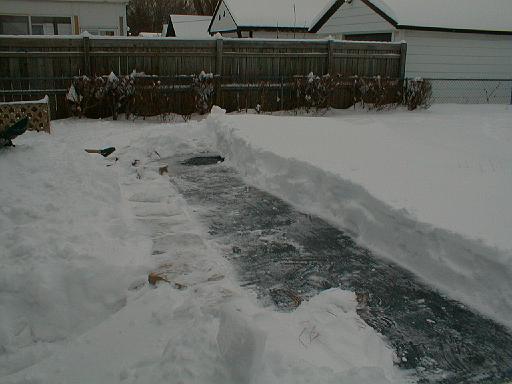 1999-01-04.pond.snow_covered.snow_half_shoveled.1.redford.mi.us 