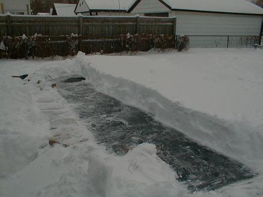 1999-01-04.pond.snow_covered.snow_half_shoveled.2.redford.mi.us 