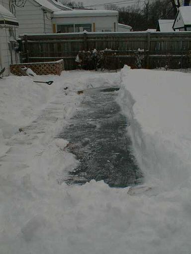 1999-01-04.pond.snow_covered.snow_half_shoveled.4.redford.mi.us 