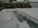 1999-01-04.pond.snow_covered.snow_half_shoveled.1.redford.mi.us.jpg