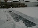 1999-01-04.pond.snow_covered.snow_half_shoveled.2.redford.mi.us.jpg