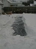 1999-01-04.pond.snow_covered.snow_half_shoveled.4.redford.mi.us.jpg