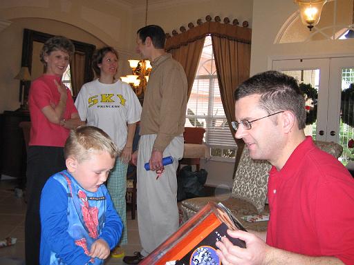 2004-12-25.opening_presents.kevin-snyder-ethan.2.christmas.venice.fl.us 