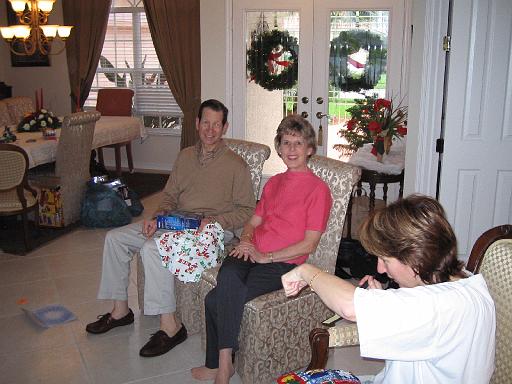 2004-12-25.opening_presents.wendy-sandy-snyder.1.christmas.venice.fl.us 