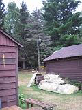 2005-08-21.dead_tree.cutting.down.2b.lumberjack.kevin-snyder.lake_cabin.cook.mn.us.jpg